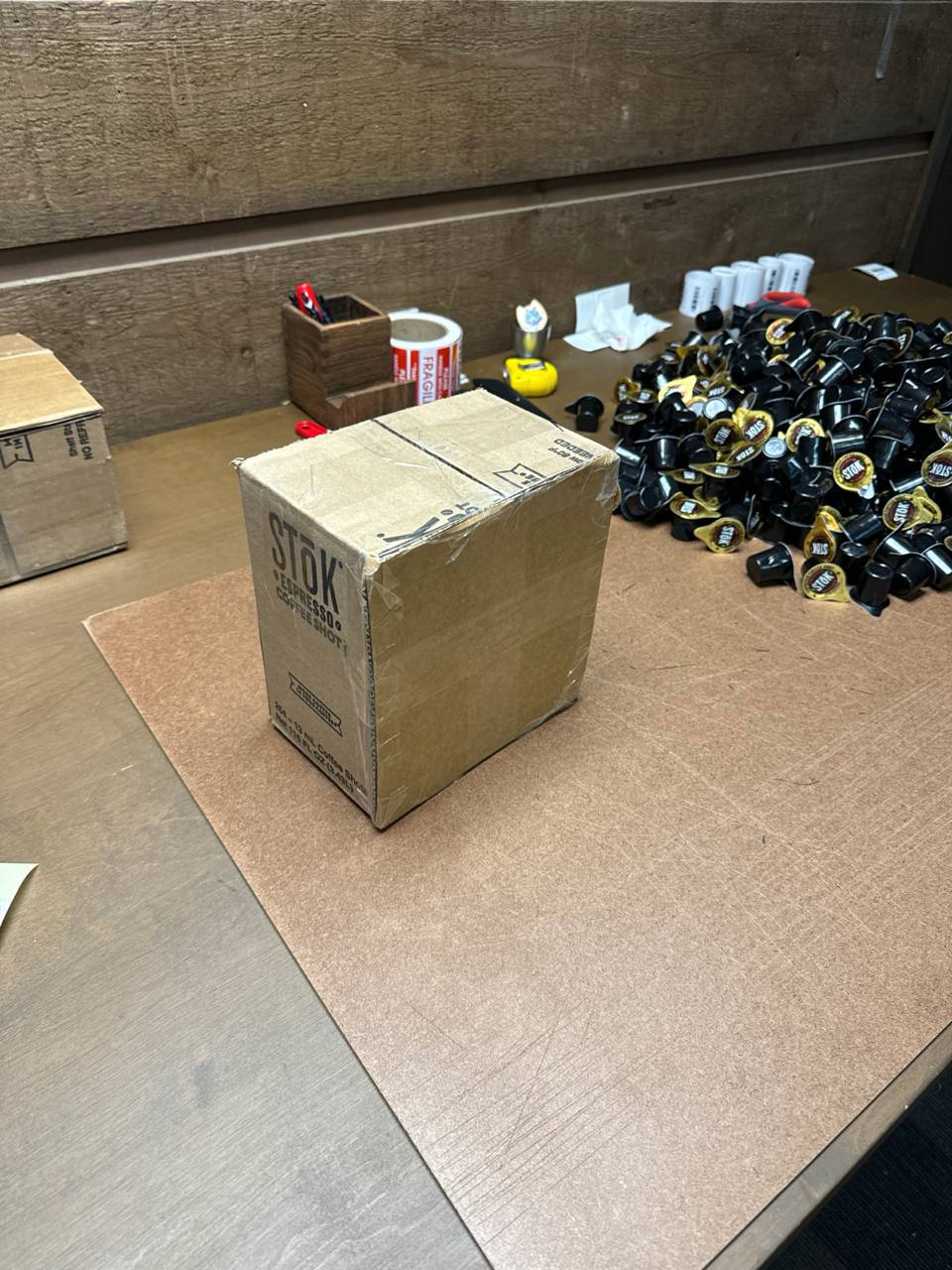 Packing station with a sealed carton and product units